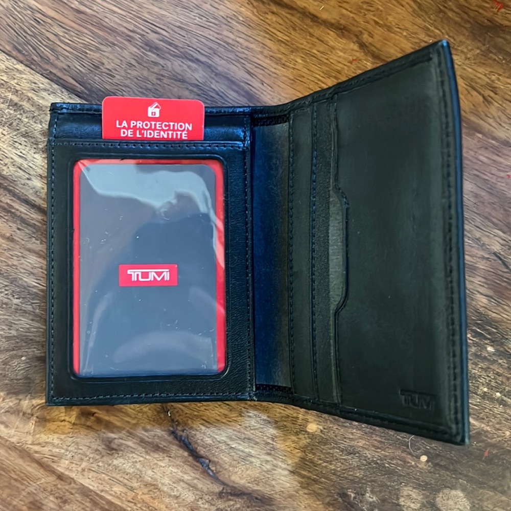Men’s black TUMI wallet - never used